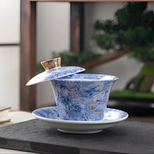 Load image into Gallery viewer, Chinoiserie Enamel Porcelain Tea Bowl with Rotating Three-Cup Design and Gold Lid