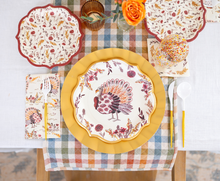 Load image into Gallery viewer, Elevate your festive harvest meal or gathering with the Amber Harvest Table Setting by Sophistiplate. This colorful autumn tablescape features turkey-themed designer disposable plates, a yellow charger, floral napkins, and plastic flatware, all beautifully arranged alongside an orange flower centerpiece on a plaid runner and crisp white tablecloth.