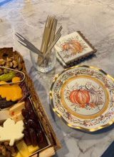 Load image into Gallery viewer, A charcuterie board next to Turkey & Gourds: Thanksgiving Table for 16 decorative plates and pumpkin-patterned napkins, with a glass holding wooden appetizer forks.