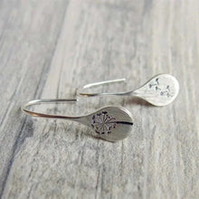 Load image into Gallery viewer, Shimmering sterling silver teardrop dangle earrings for women with intricate dandelion design. Elegant and unique jewelry.