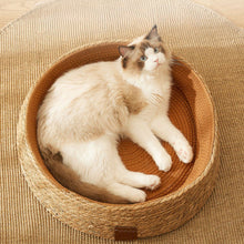 Load image into Gallery viewer, Hand-woven rattan cat bed with integrated scratching post. Natural, durable pet furniture for comfort & play.