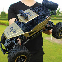 Load image into Gallery viewer, Rechargeable 1:12 Scale 4WD Remote Control Monster Truck with Two Battery Packs and a 2.4GHz Controller