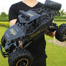 Load image into Gallery viewer, Rechargeable 1:12 Scale 4WD Remote Control Monster Truck with Two Battery Packs and a 2.4GHz Controller