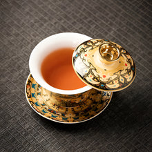 Load image into Gallery viewer, Chinoiserie Enamel Porcelain Tea Bowl with Rotating Three-Cup Design and Gold Lid

