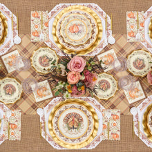Load image into Gallery viewer, Sure! Here’s the revised sentence using your provided product data: Celebrate Thanksgiving in style with the Turkey &amp; Gourds Table Setting by Sophistiplate, a fall-themed party-in-a-box that includes designer disposable plates adorned with turkeys and pumpkins, gold chargers, a floral centerpiece featuring pink roses, a plaid tablecloth, and matching napkins—all beautifully coordinated to create stunning Thanksgiving table decor when viewed from above.
