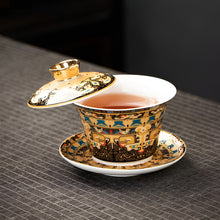 Load image into Gallery viewer, Chinoiserie Enamel Porcelain Tea Bowl with Rotating Three-Cup Design and Gold Lid
