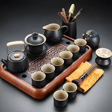 Load image into Gallery viewer, Black Clay Kung Fu Tea Set with Anti-scalding Handle Teapot and Matching Cups for Home Tea Ceremony
