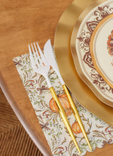 Load image into Gallery viewer, Sophistiplate Turkey &amp; Gourds Guest Towels/20pk featuring a scalloped edge and fall pumpkin pattern, styled with a white and gold fork and knife next to a decorative plate.

