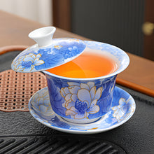 Load image into Gallery viewer, Chinoiserie Enamel Porcelain Tea Bowl with Rotating Three-Cup Design and Gold Lid
