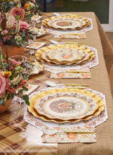 Load image into Gallery viewer, Create a warm autumn tablescape with the Turkey &amp; Gourds Table Setting Bundle from Sophistiplate LLC, featuring designer disposable plates with gold trim, floral-patterned napkins, elegant gold cutlery, and charming autumn floral centerpieces—all beautifully set atop a rustic burlap and plaid tablecloth.

