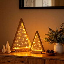 Load image into Gallery viewer, Timber Triangle Trees Set of Two in a Wooden Finish with Golden Fairy Lights at 14 and 10 Inches Tall
