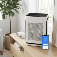 Load image into Gallery viewer, White smart air purifier in a living room
