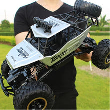 Load image into Gallery viewer, Rechargeable 1:12 Scale 4WD Remote Control Monster Truck with Two Battery Packs and a 2.4GHz Controller
