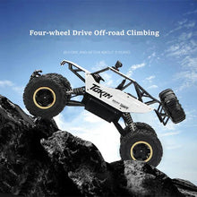 Load image into Gallery viewer, Rechargeable 1:12 Scale 4WD Remote Control Monster Truck with Two Battery Packs and a 2.4GHz Controller
