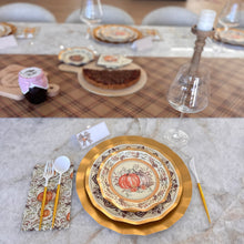 Load image into Gallery viewer, A Turkey &amp; Gourds: Thanksgiving Table for 16 setting with heavy-duty paper plates featuring a gold-rimmed pumpkin design, white and gold cutlery, and a pumpkin-print napkin arranged on a marble table with a plaid runner and dessert centerpiece.
